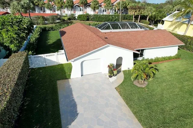 a kitchen with a refrigerator a sink and a stove top oven