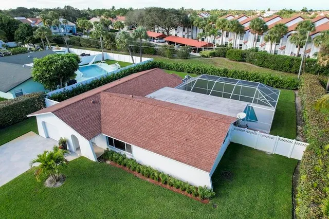 a kitchen with stainless steel appliances granite countertop a refrigerator sink and microwave