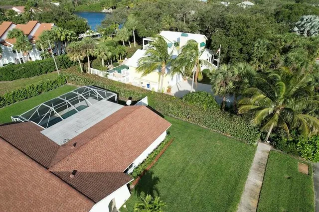a view of a house with a backyard