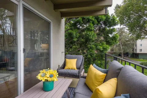 a view of a couches in the balcony