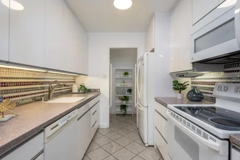 a kitchen with a stove and a sink