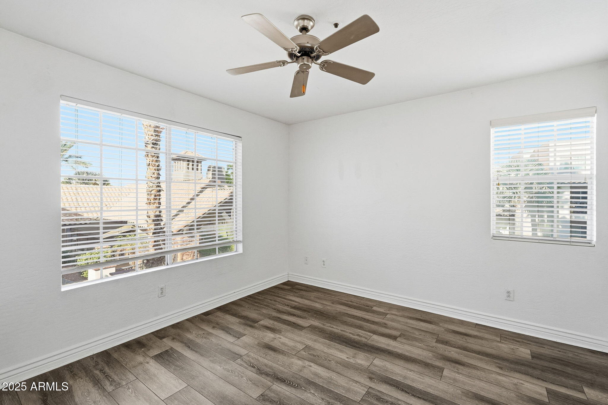 14145 North 92nd Street, Unit 2028 Scottsdale, AZ 85260 - Photo 11 of 24 a view of an empty room with window and a kitchen