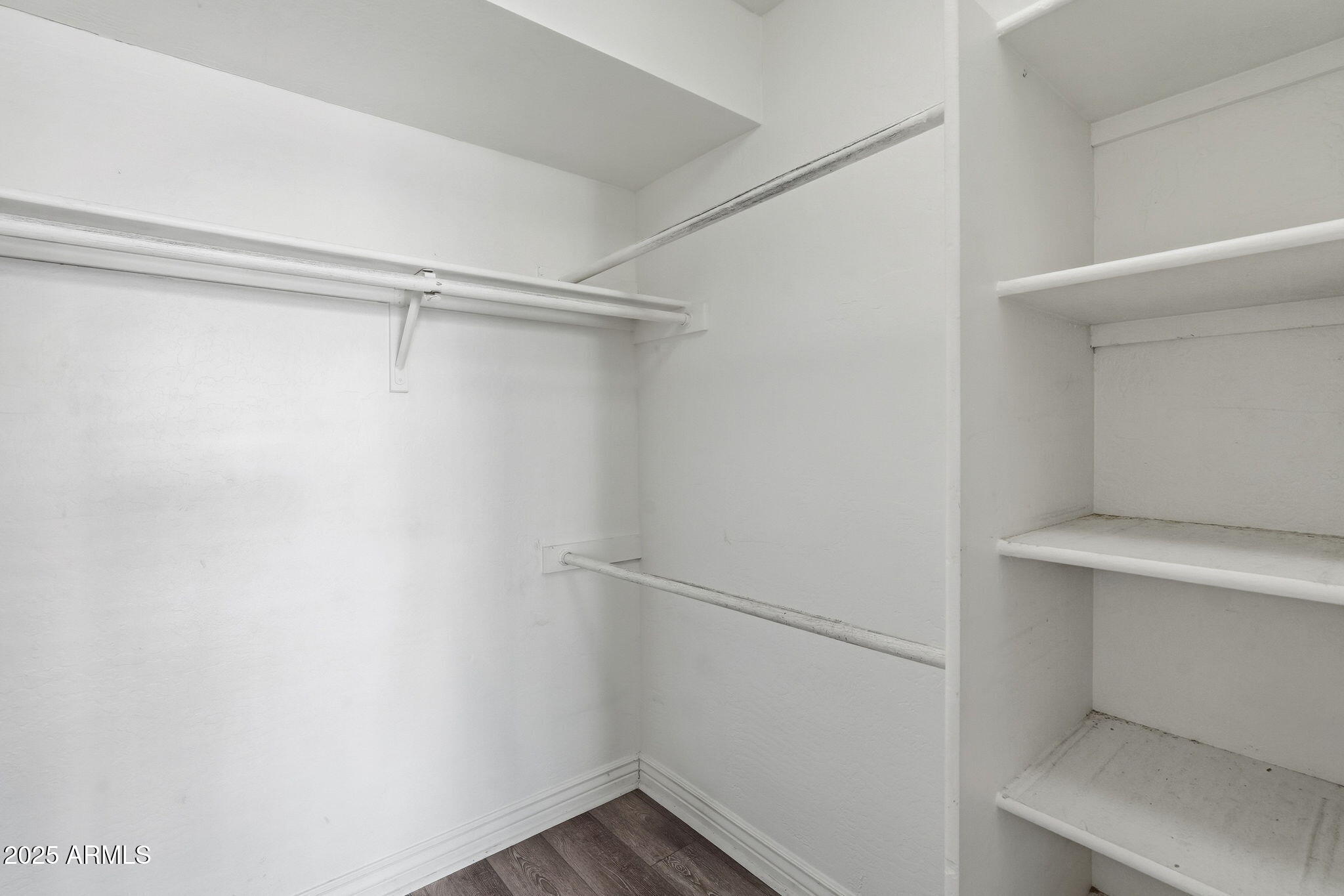 14145 North 92nd Street, Unit 2028 Scottsdale, AZ 85260 - Photo 19 of 24 a view of an empty walk in closet