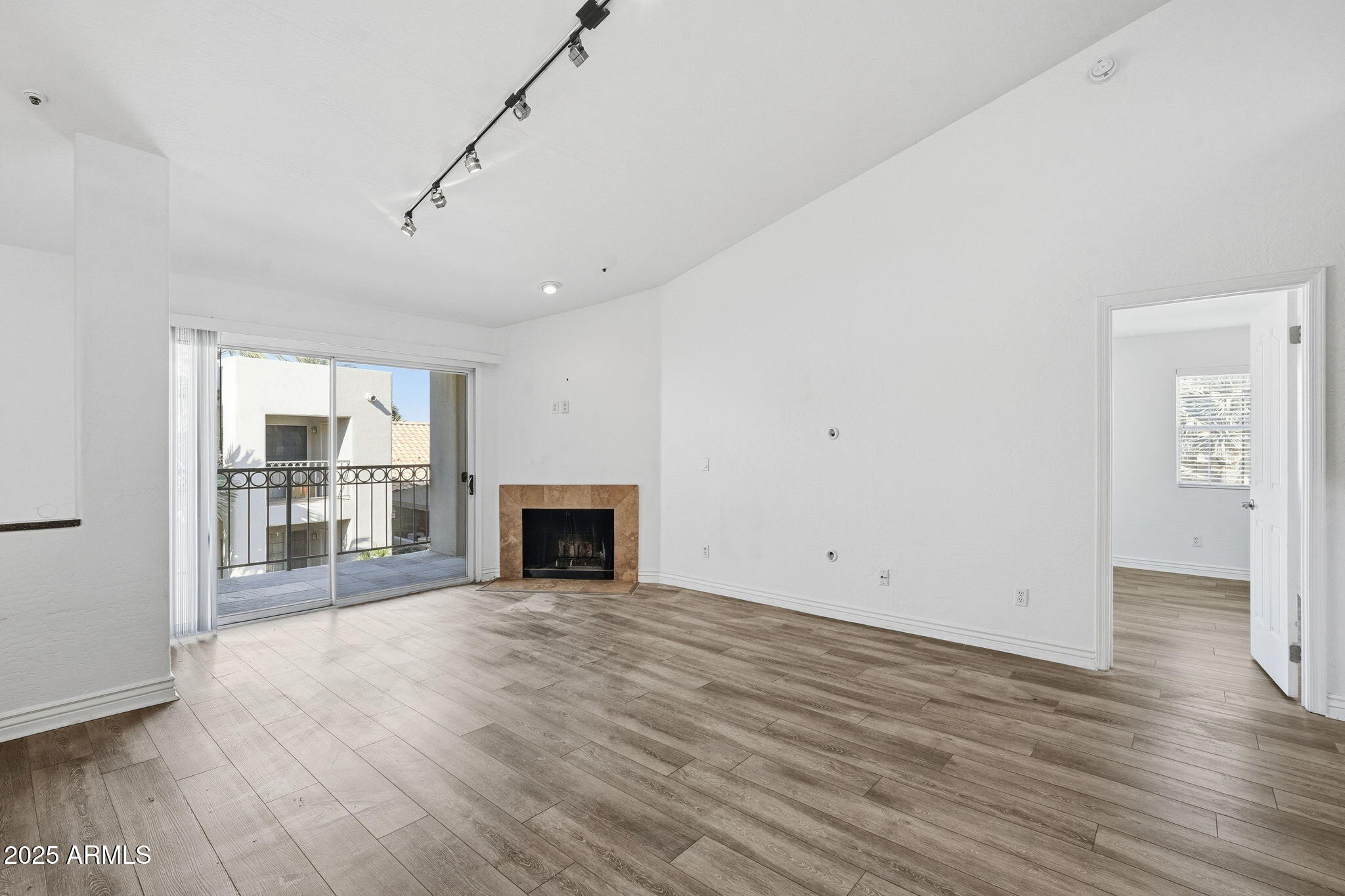 14145 North 92nd Street, Unit 2028 Scottsdale, AZ 85260 - Photo 24 of 24 a view of empty room with wooden floor