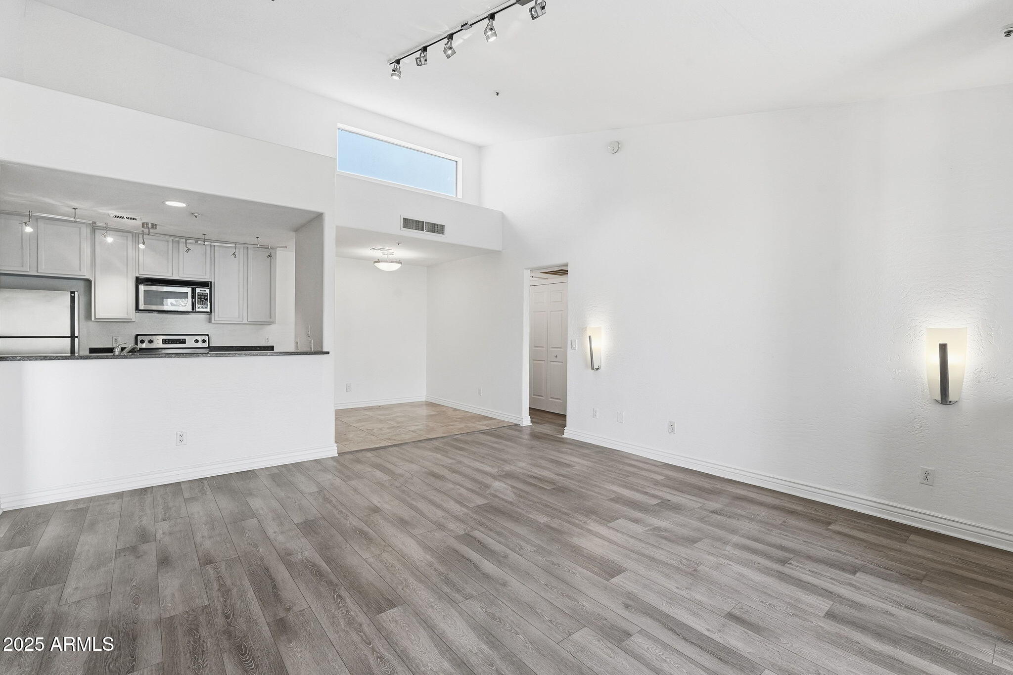 14145 North 92nd Street, Unit 2028 Scottsdale, AZ 85260 - Photo 5 of 24 a view of kitchen with wooden floor