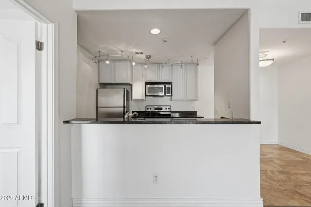 a view of kitchen with wooden floor