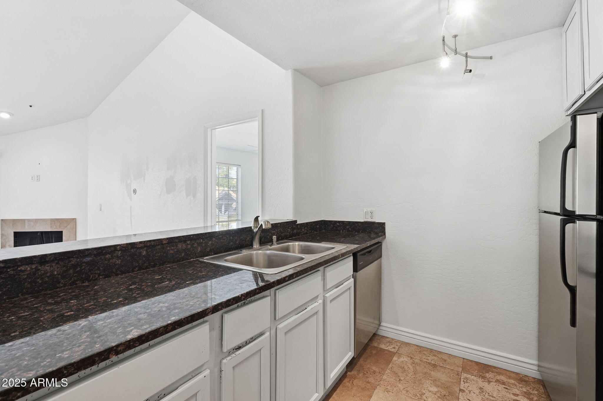 14145 North 92nd Street, Unit 2028 Scottsdale, AZ 85260 - Photo 7 of 24 a bathroom with a granite countertop sink and a mirror