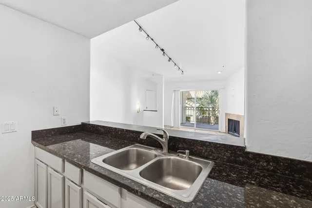 a kitchen with a refrigerator stove and microwave