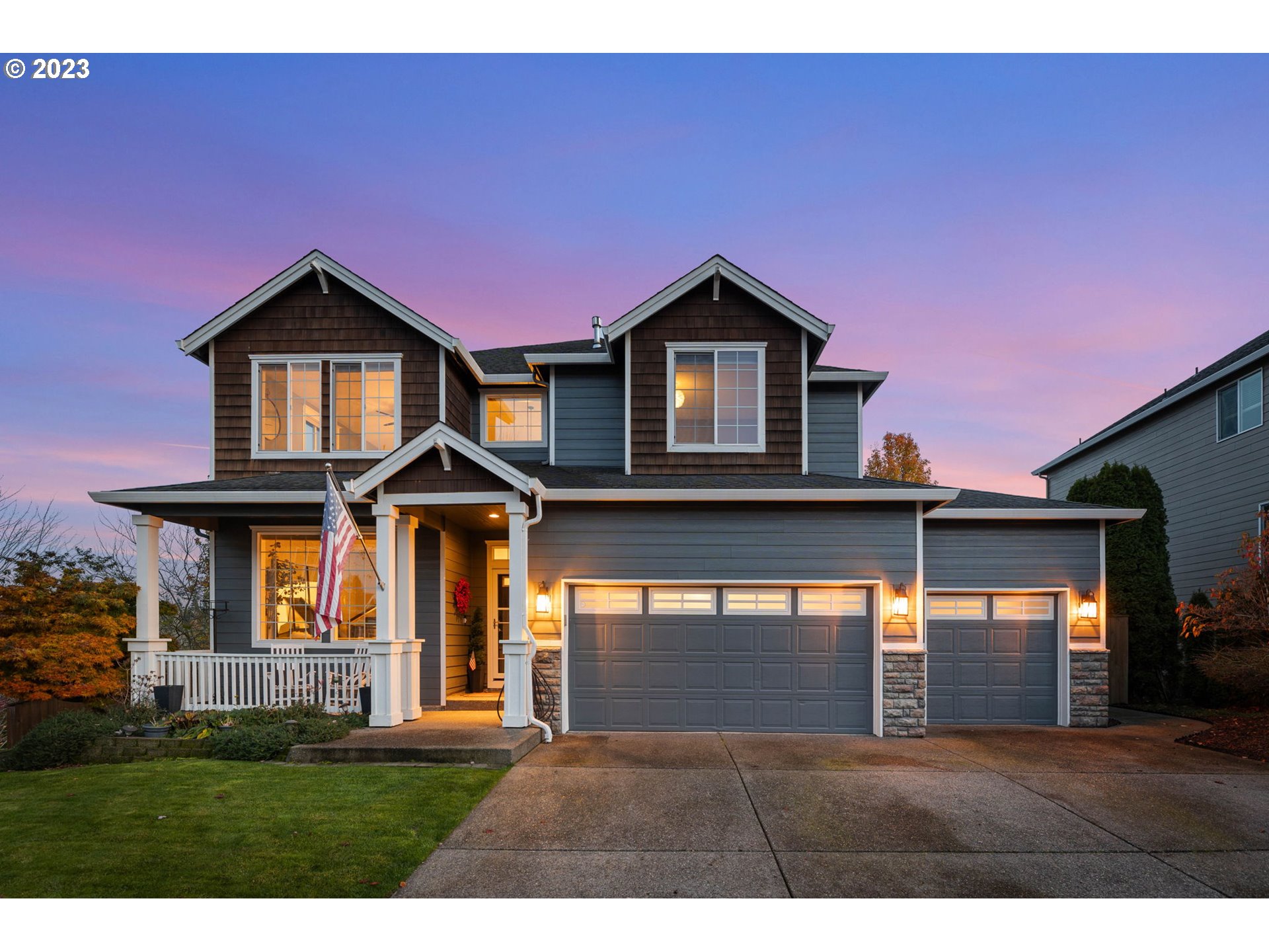 1913 South 15th Circle Ridgefield, WA 98642 - Photo 1 of 33 a front view of a house with a yard and garage
