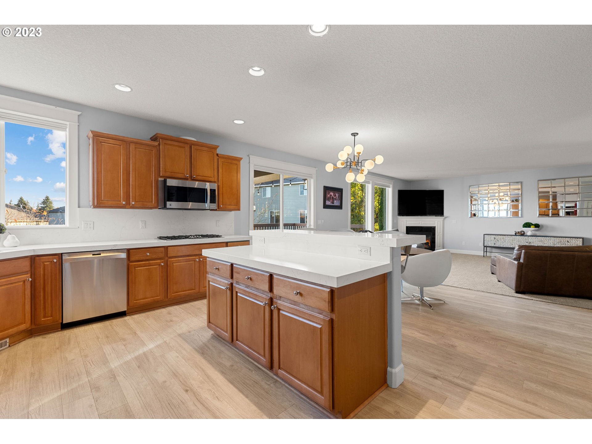 1913 South 15th Circle Ridgefield, WA 98642 - Photo 12 of 33 a kitchen with a sink cabinets and wooden floor