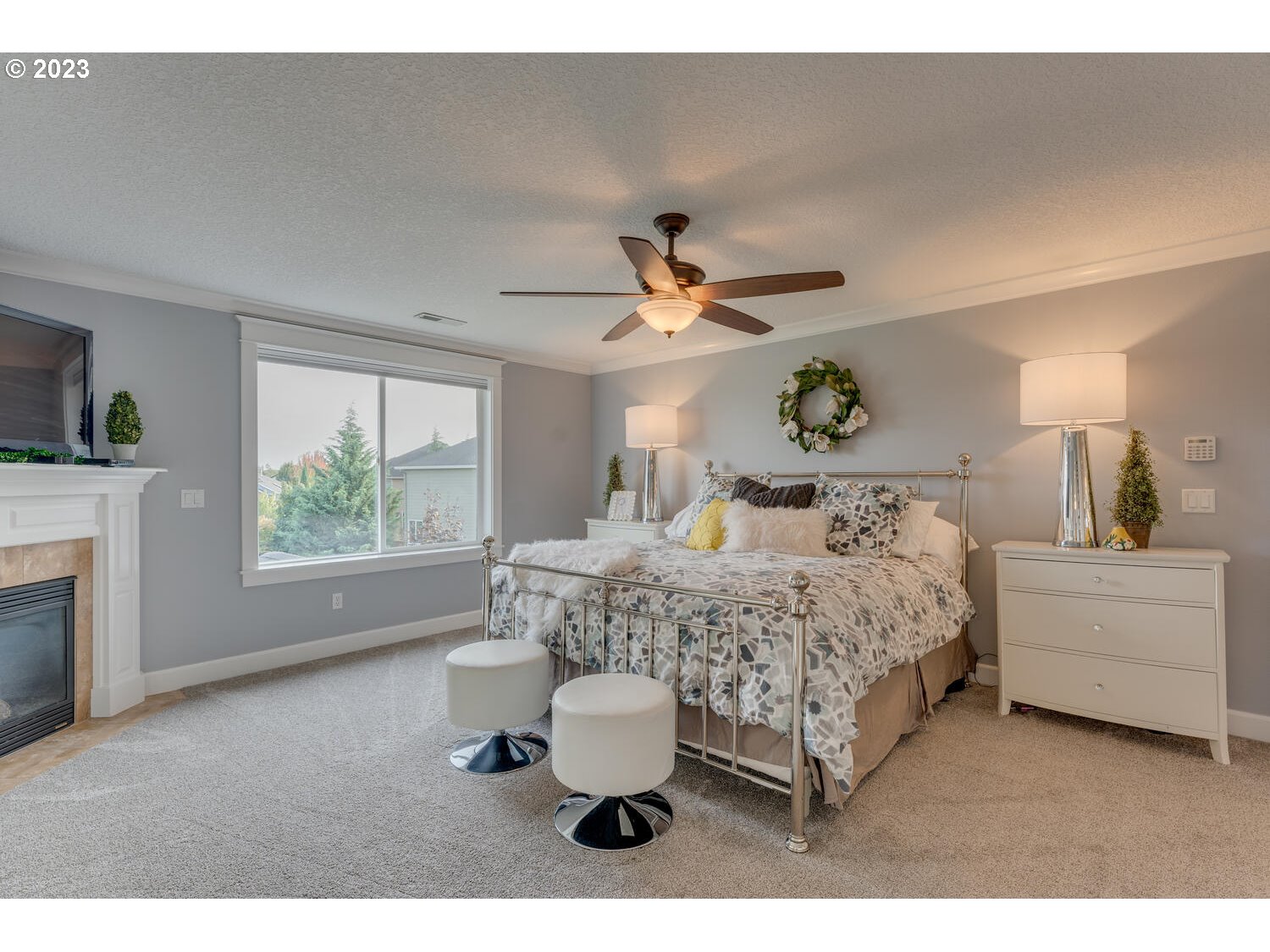 1913 South 15th Circle Ridgefield, WA 98642 - Photo 17 of 33 a bed room with a bed and a fireplace