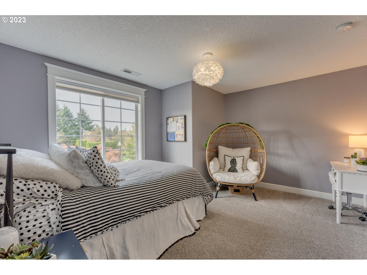 1913 South 15th Circle Ridgefield, WA 98642 - Photo 22 of 33 a bedroom with a bed mirror and a window