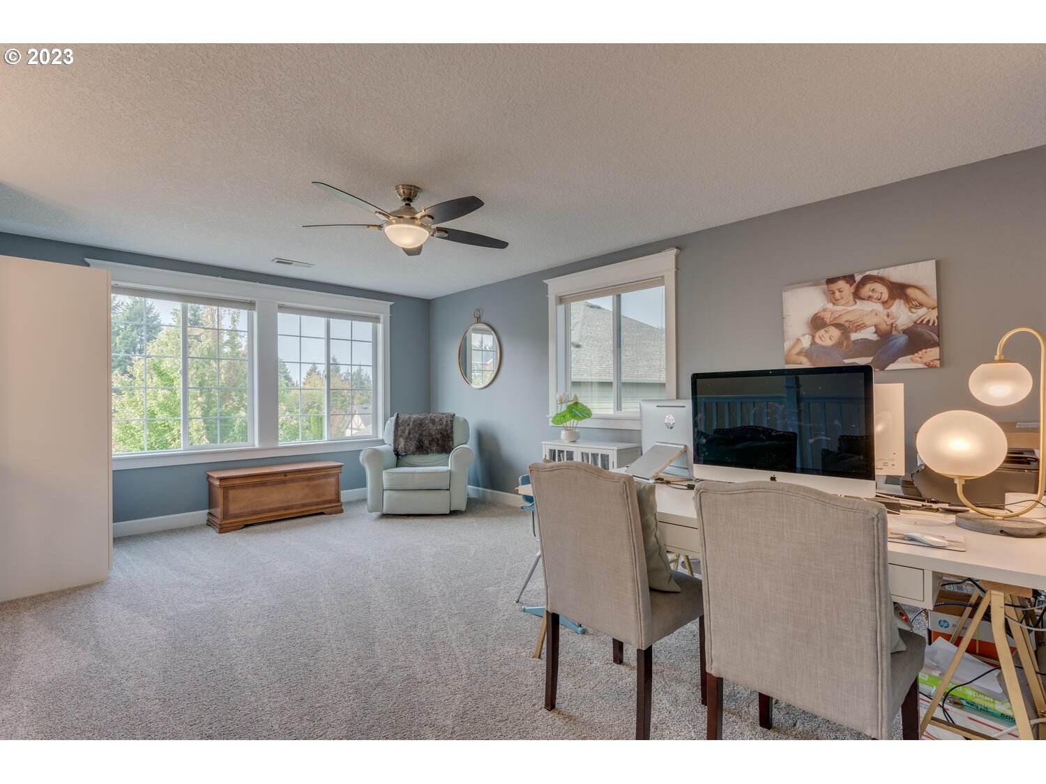 1913 South 15th Circle Ridgefield, WA 98642 - Photo 24 of 33 a living room with furniture and a flat screen tv