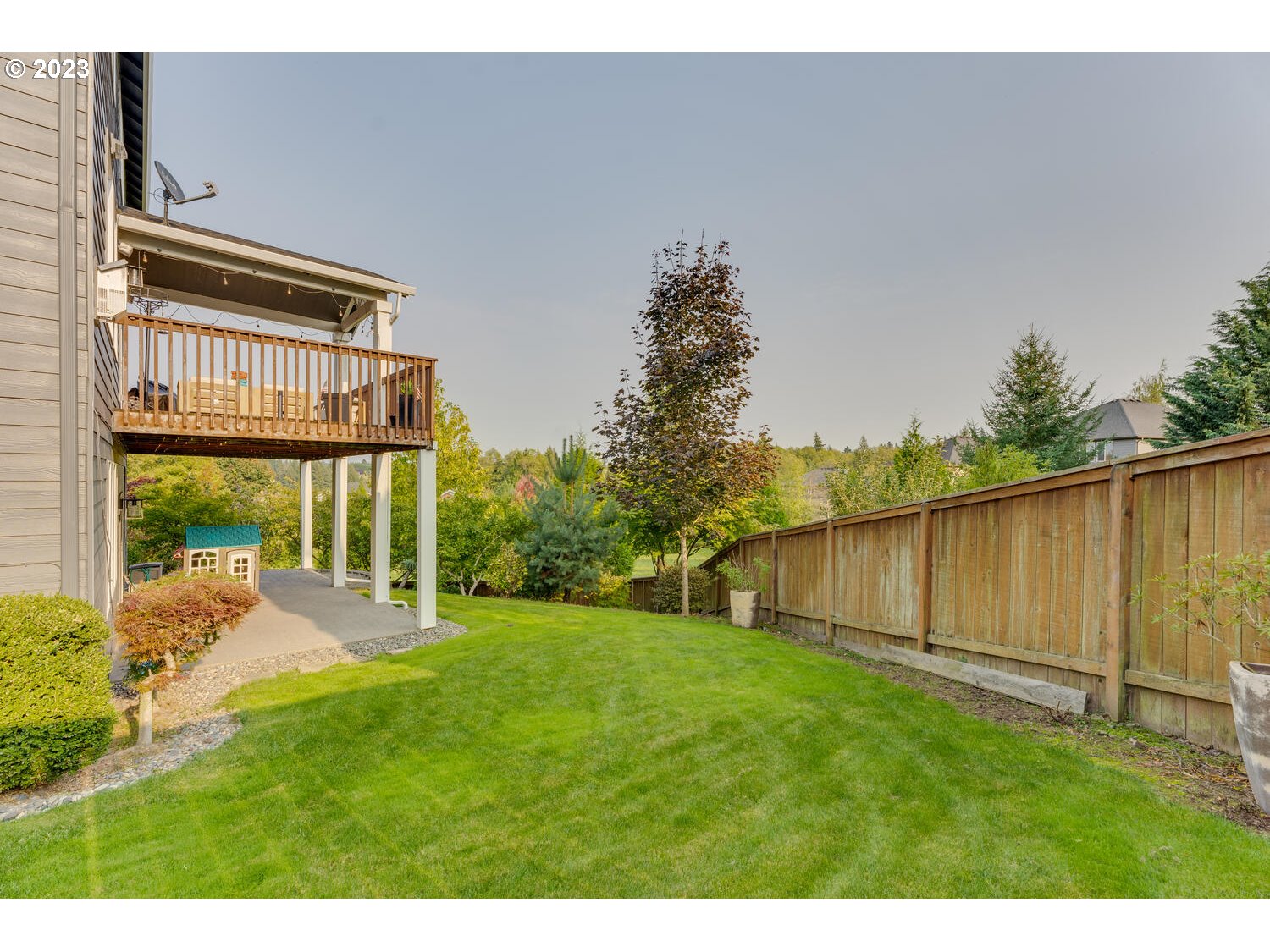 1913 South 15th Circle Ridgefield, WA 98642 - Photo 28 of 33 a view of a backyard with plants and a patio