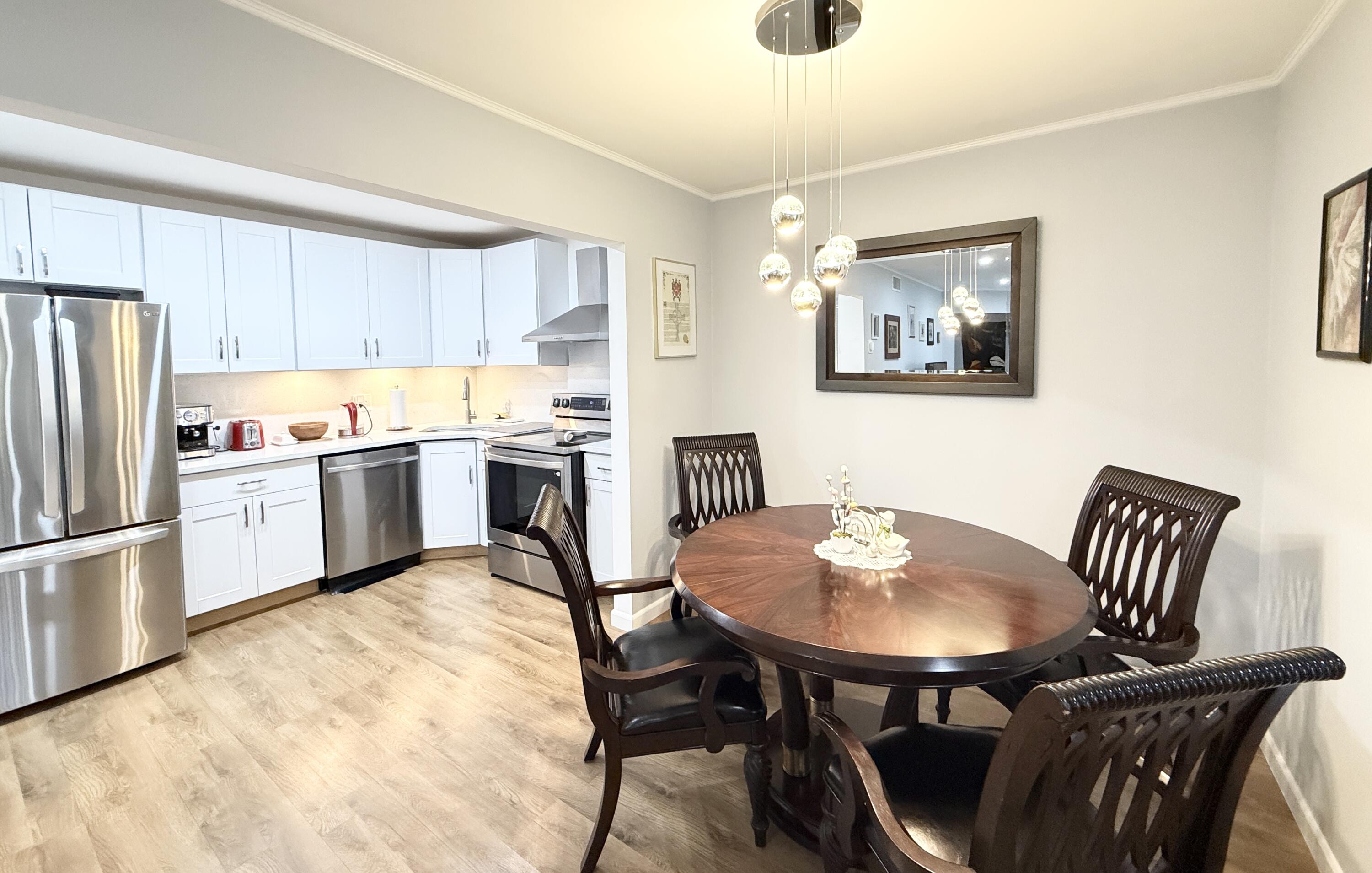 301 Pine Ridge Circle, Unit C2 Greenacres, FL 33463 - Photo 1 of 28 Dining kitchen