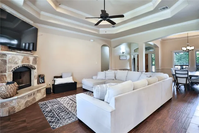 a living room with furniture and a fireplace