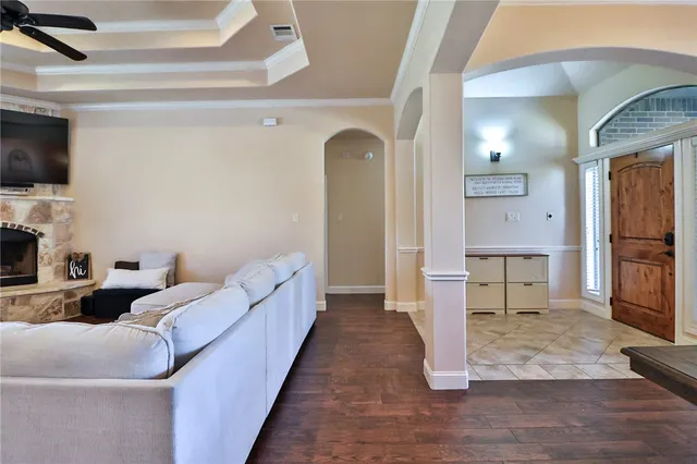 a living room with furniture fireplace and flat screen tv