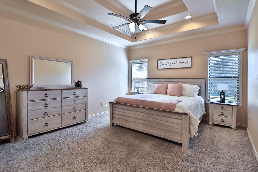 3900 Ambrose Court Bryan, TX 77808 - Photo 18 of 34 a bedroom with a bed and a dresser