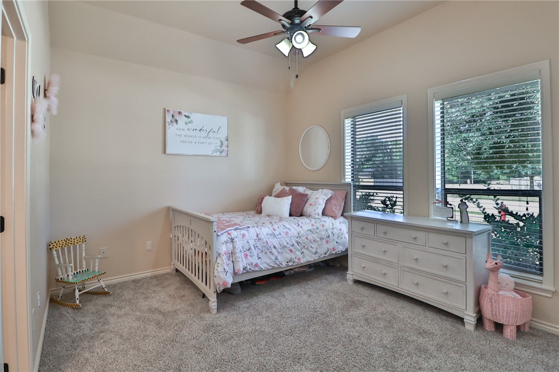 3900 Ambrose Court Bryan, TX 77808 - Photo 29 of 34 a bedroom with a bed and a window