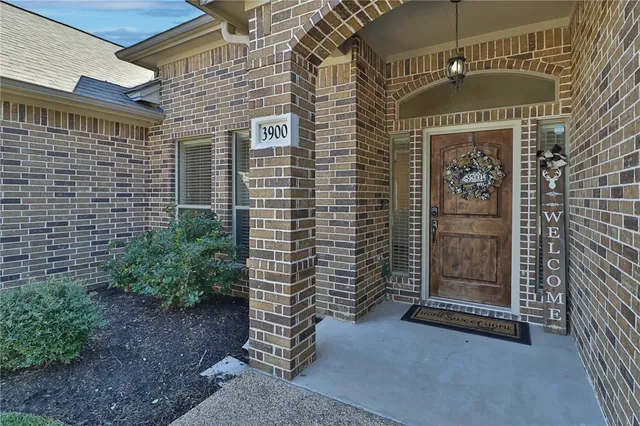 a view of a brick house with an outdoor space