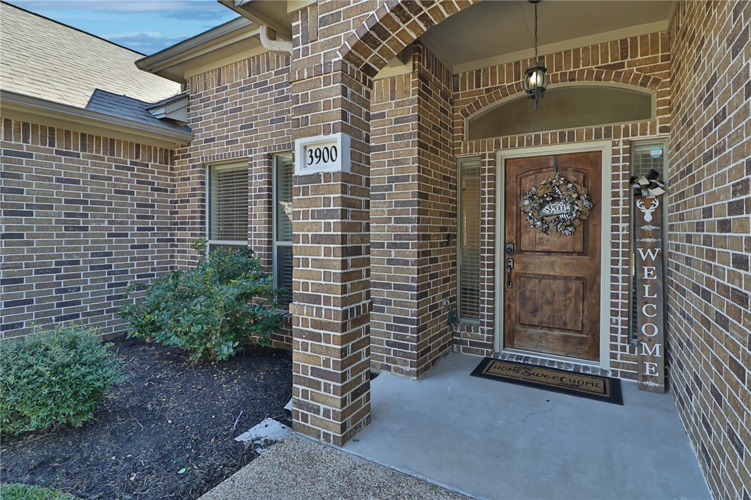 3900 Ambrose Court Bryan, TX 77808 - Photo 3 of 34 a view of a brick house with an outdoor space