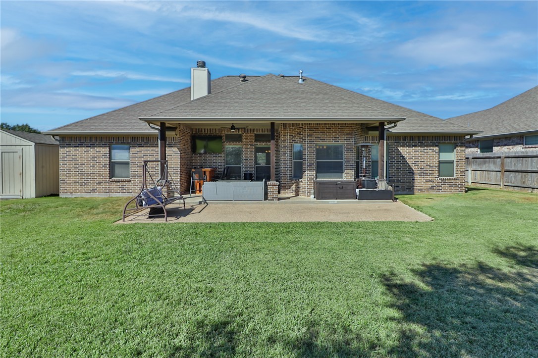 3900 Ambrose Court Bryan, TX 77808 - Photo 30 of 34 a view of a house with backyard porch and sitting area