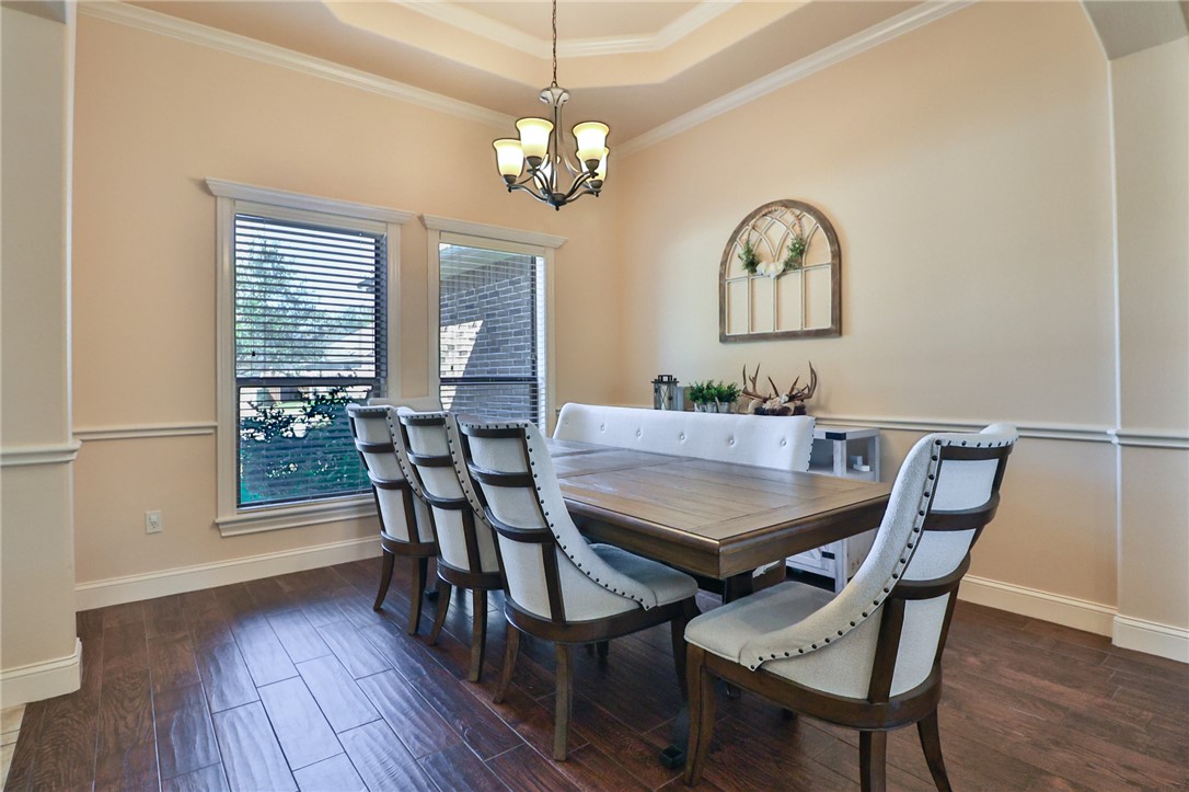 3900 Ambrose Court Bryan, TX 77808 - Photo 5 of 34 a view of a dining room with furniture window and wooden floor