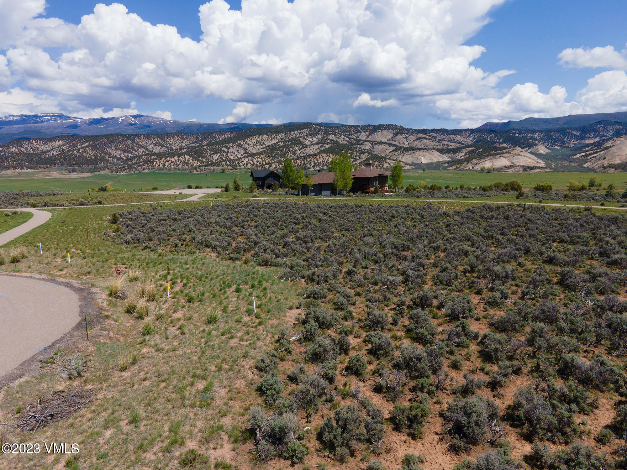 100 Prospect Peak Road Eagle, CO 81631 - Photo 11 of 63 a view of a lake with a building in the background
