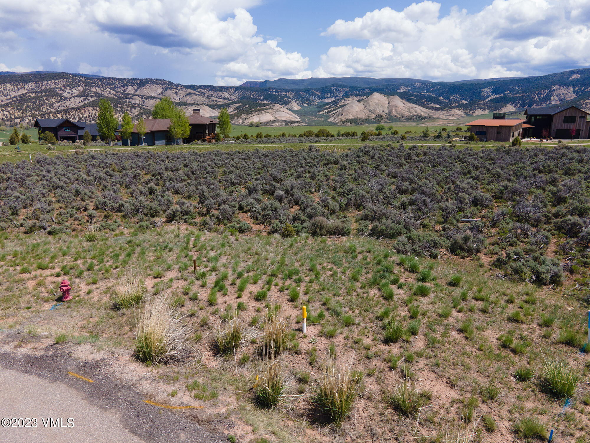 100 Prospect Peak Road Eagle, CO 81631 - Photo 17 of 63 a view of a dry yard with large trees