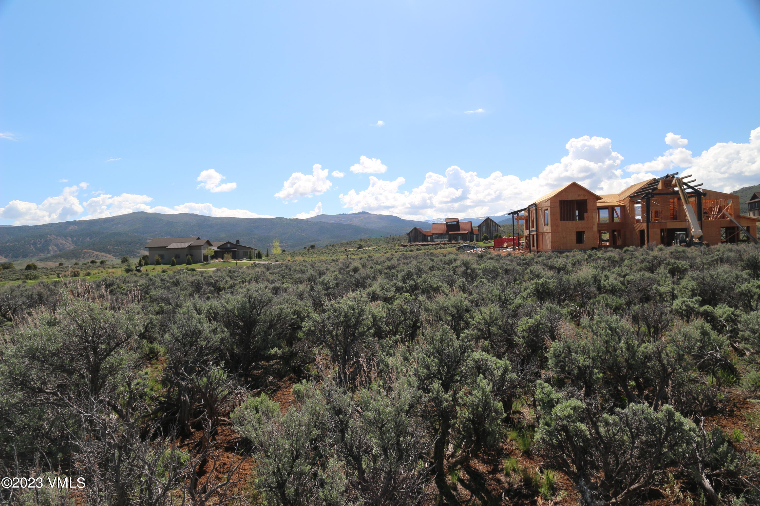 100 Prospect Peak Road Eagle, CO 81631 - Photo 26 of 63 a view of a house with a big yard and large trees