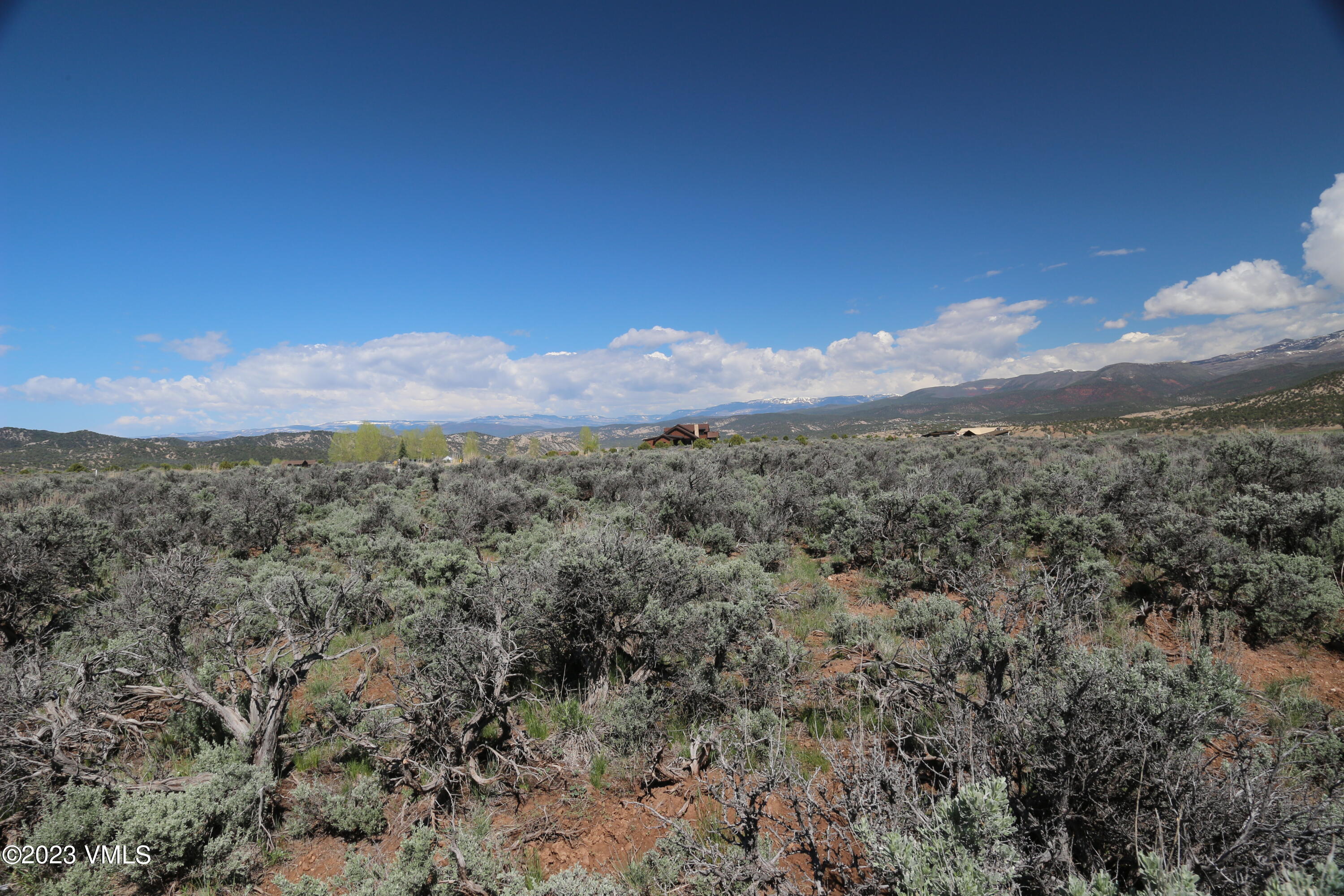 100 Prospect Peak Road Eagle, CO 81631 - Photo 31 of 63 a view of a mountain range with lush green forest