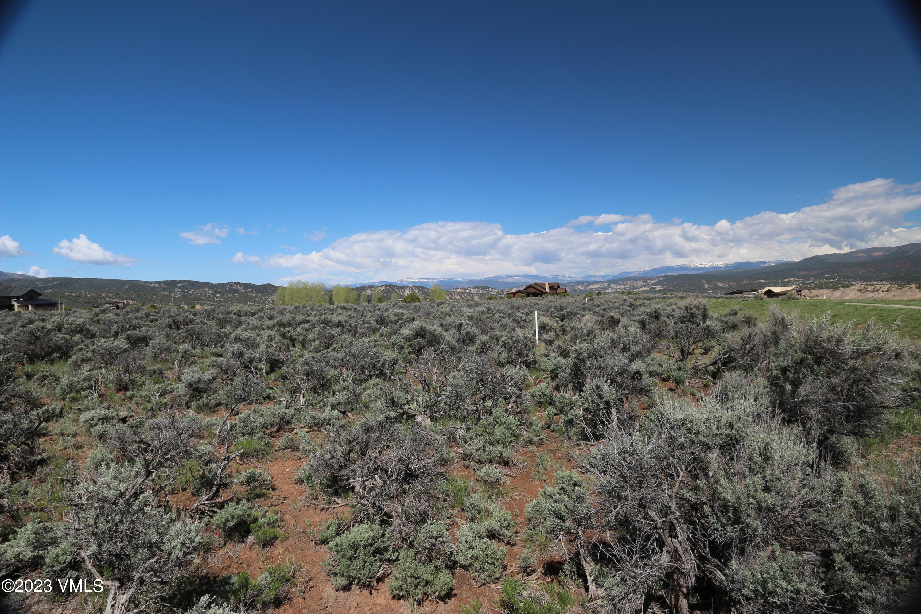 100 Prospect Peak Road Eagle, CO 81631 - Photo 32 of 63 a view of a mountain in the distance in a field