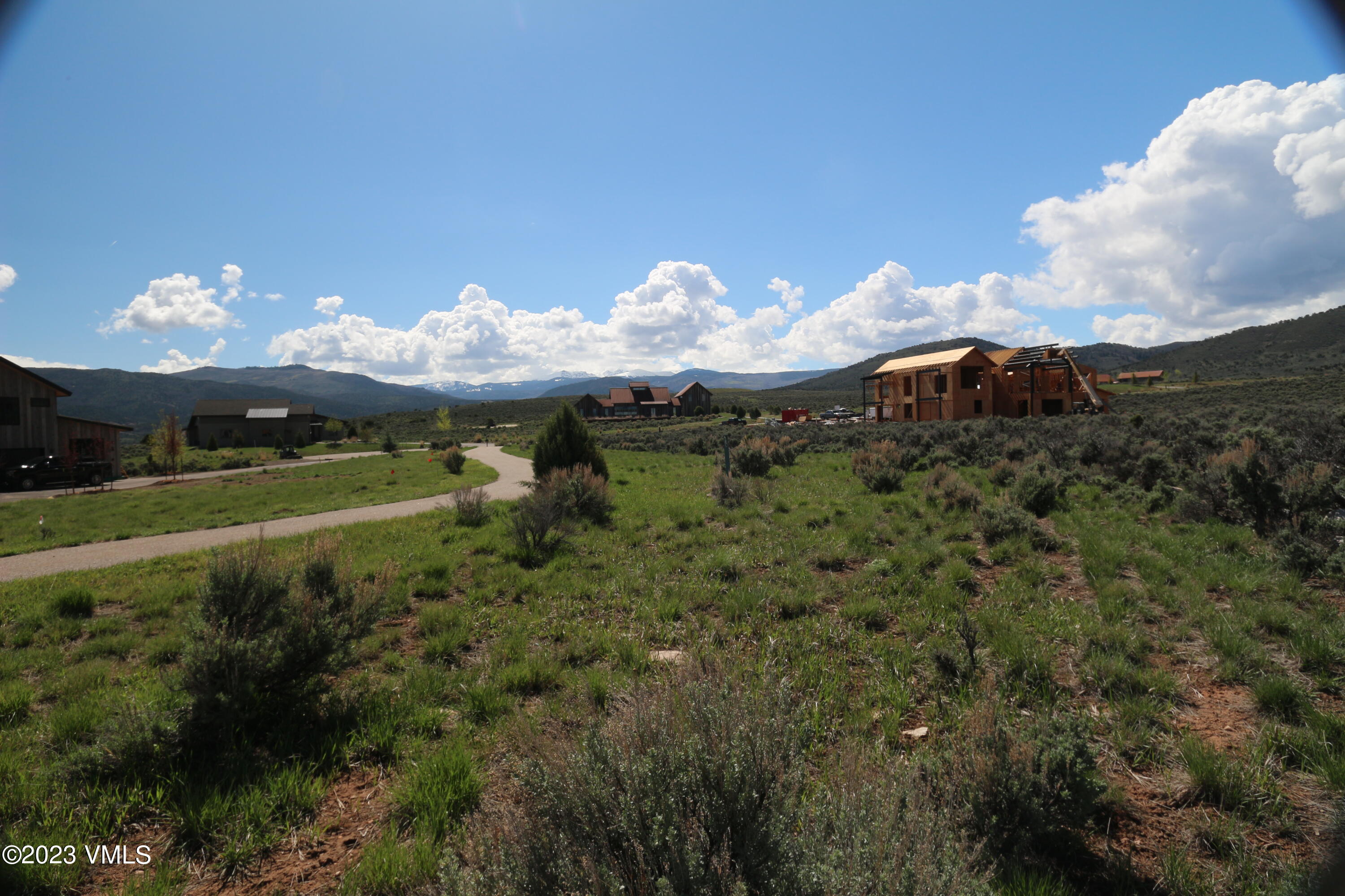 100 Prospect Peak Road Eagle, CO 81631 - Photo 35 of 63 a view of a fountain in a big yard with large trees