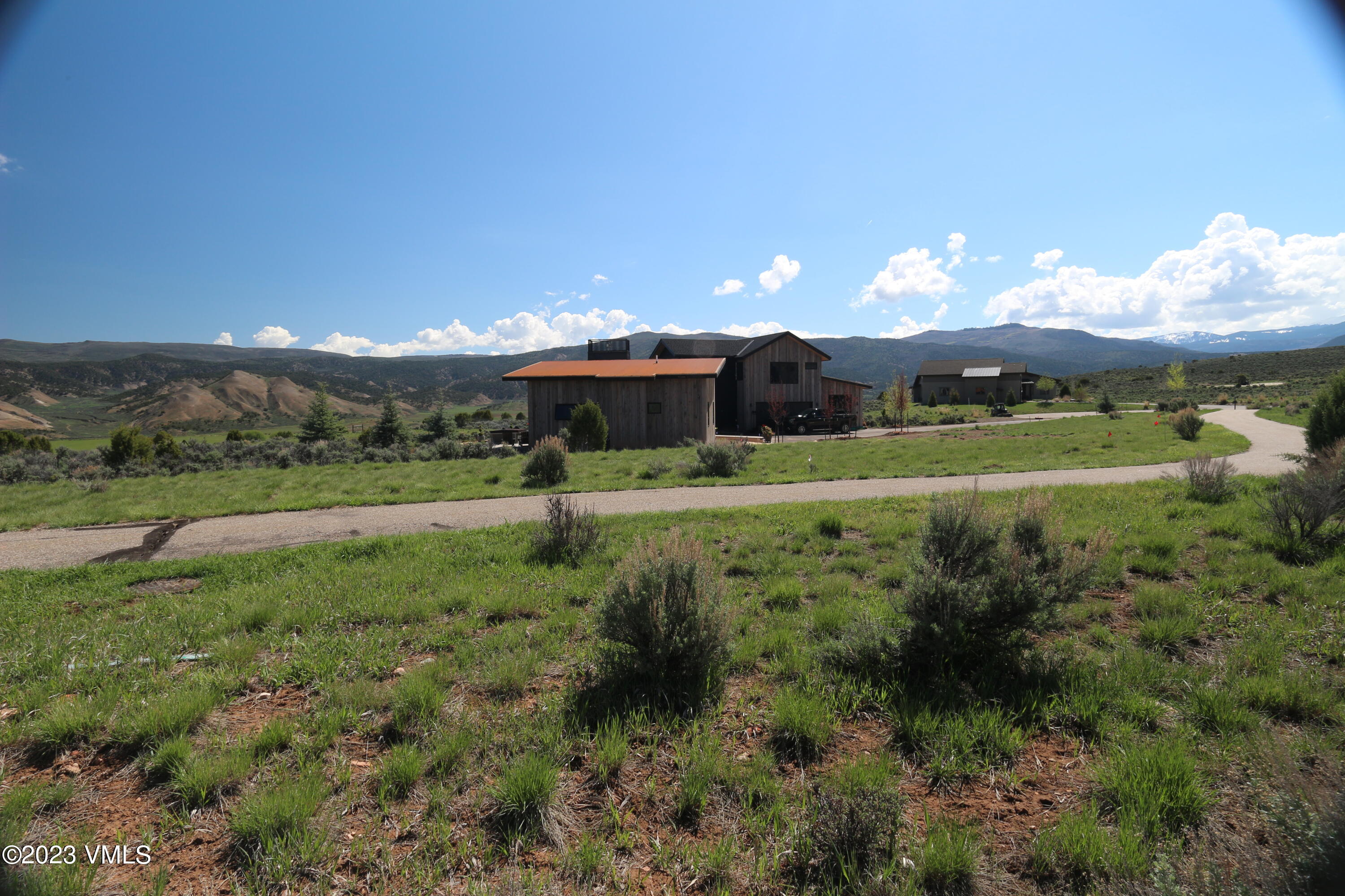 100 Prospect Peak Road Eagle, CO 81631 - Photo 37 of 63 a view of a big yard with potted plants and large tree