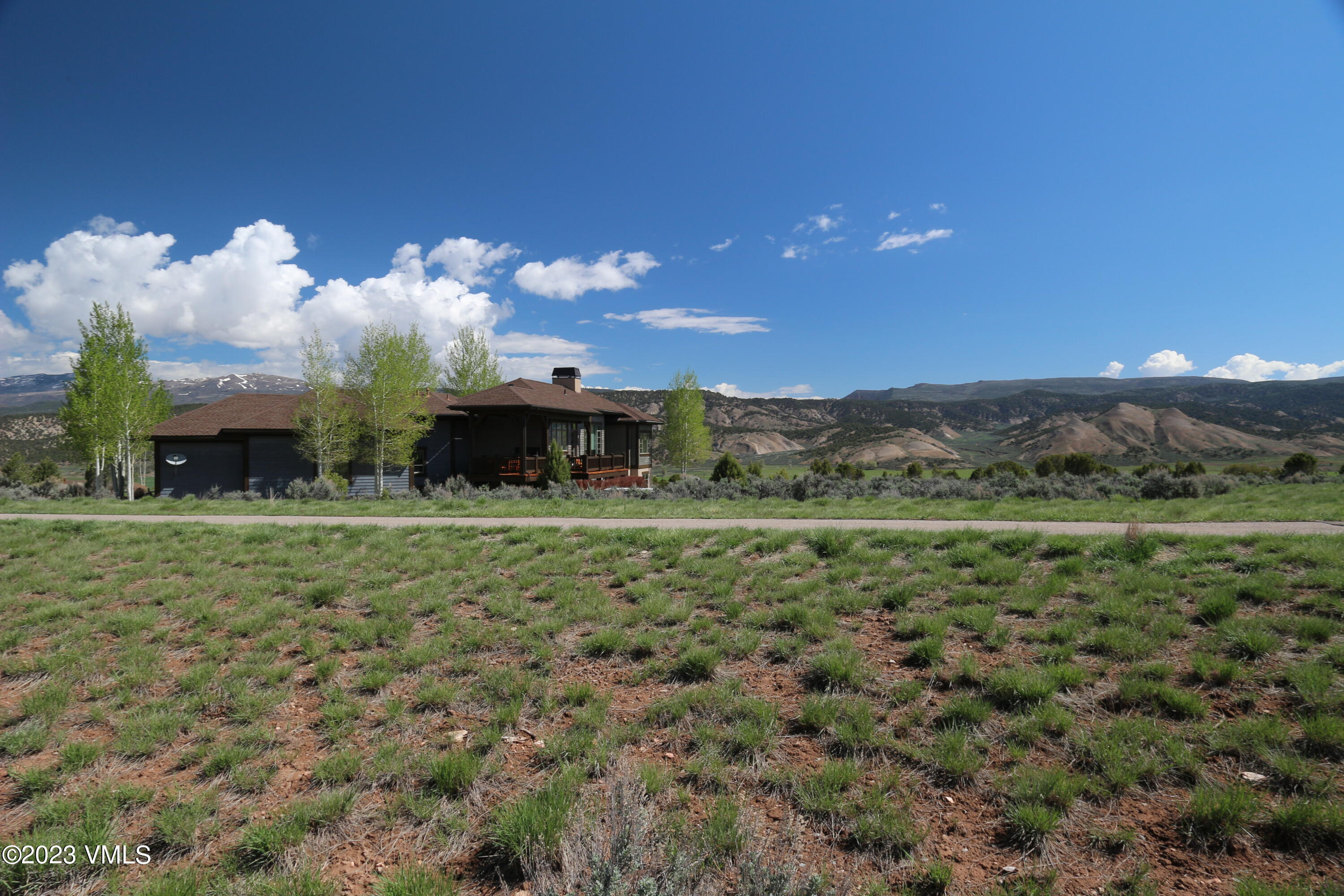 100 Prospect Peak Road Eagle, CO 81631 - Photo 43 of 63 a view of a big house with a big yard