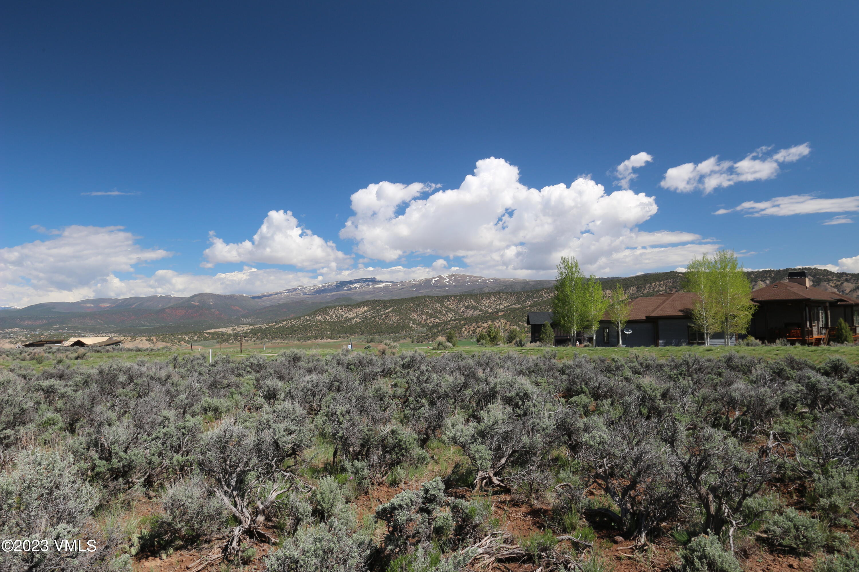 100 Prospect Peak Road Eagle, CO 81631 - Photo 49 of 63 a view of a house with a big yard and large trees