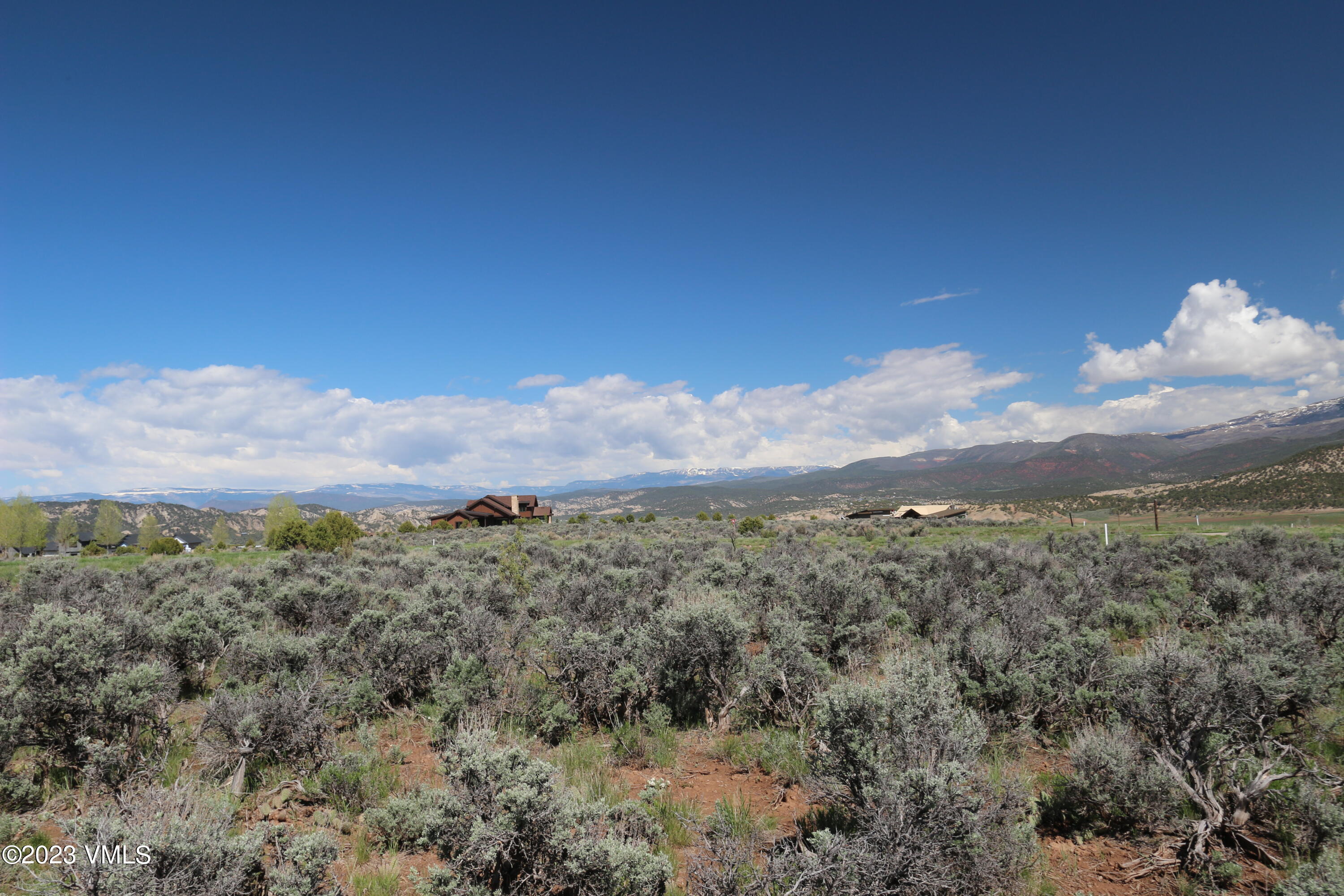 100 Prospect Peak Road Eagle, CO 81631 - Photo 50 of 63 a view of a town with mountains in the background