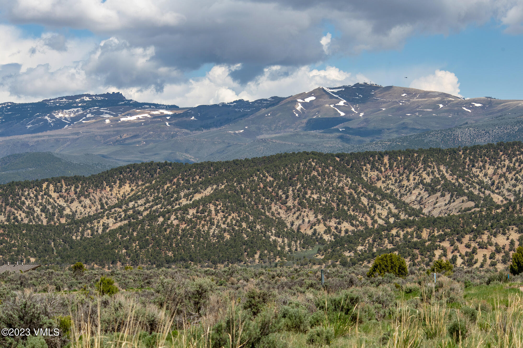 100 Prospect Peak Road Eagle, CO 81631 - Photo 63 of 63 a view of a lake with a yard from a large building