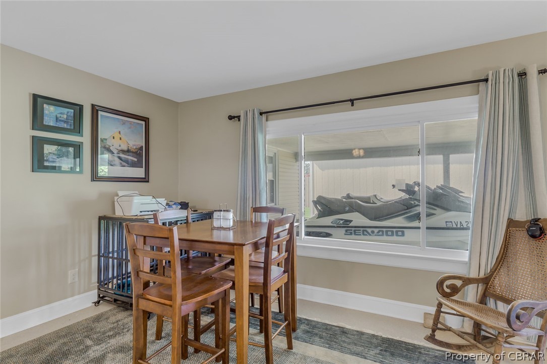 314 Callis Road Lancaster, VA 22503 - Photo 15 of 41 a view of a dining room with furniture and window