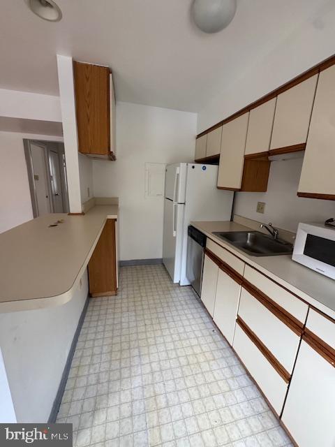 42 Conshohocken State Road, Unit 8D Bala Cynwyd, PA 19004 - Photo 15 of 20 a kitchen with a sink and a stove top oven