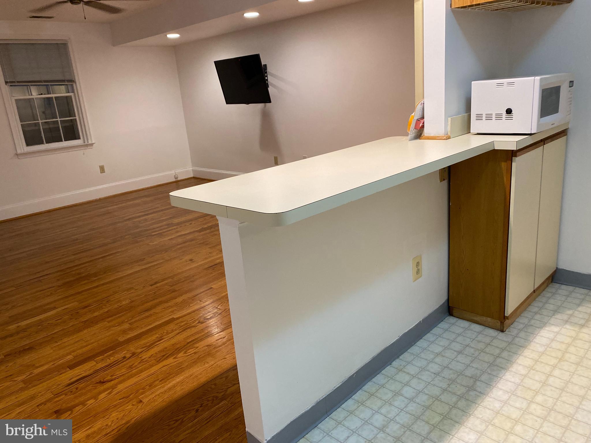 42 Conshohocken State Road, Unit 8D Bala Cynwyd, PA 19004 - Photo 6 of 20 a workspace with wooden floor