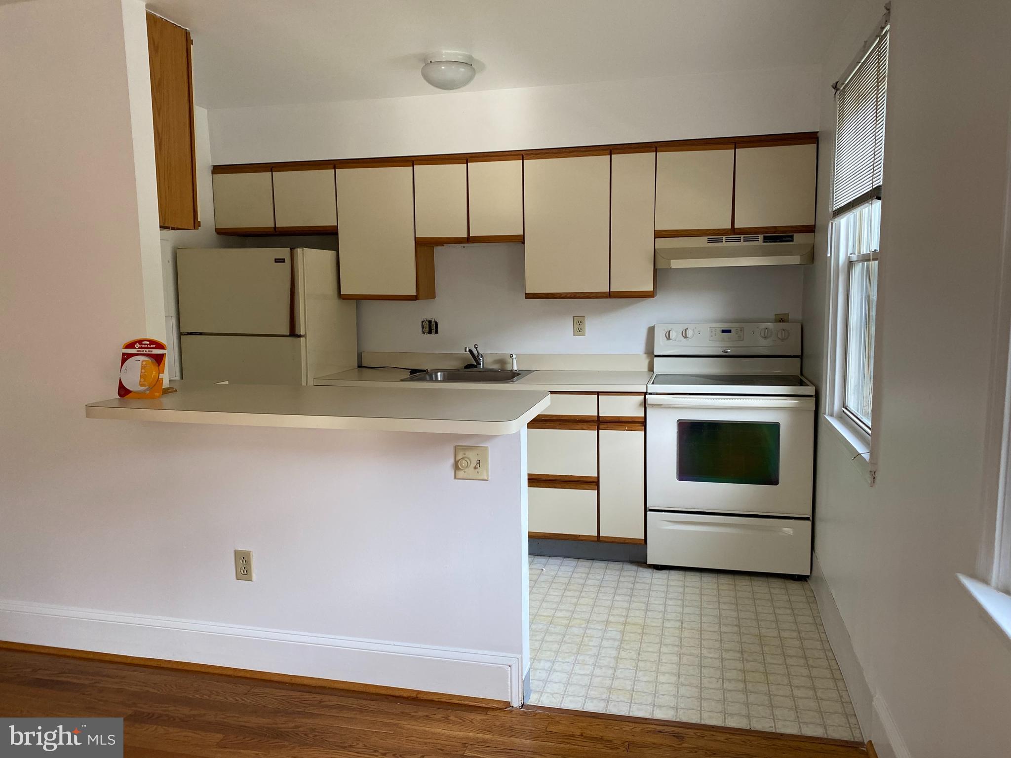 42 Conshohocken State Road, Unit 8D Bala Cynwyd, PA 19004 - Photo 7 of 20 a kitchen with stainless steel appliances granite countertop a sink a stove and cabinets