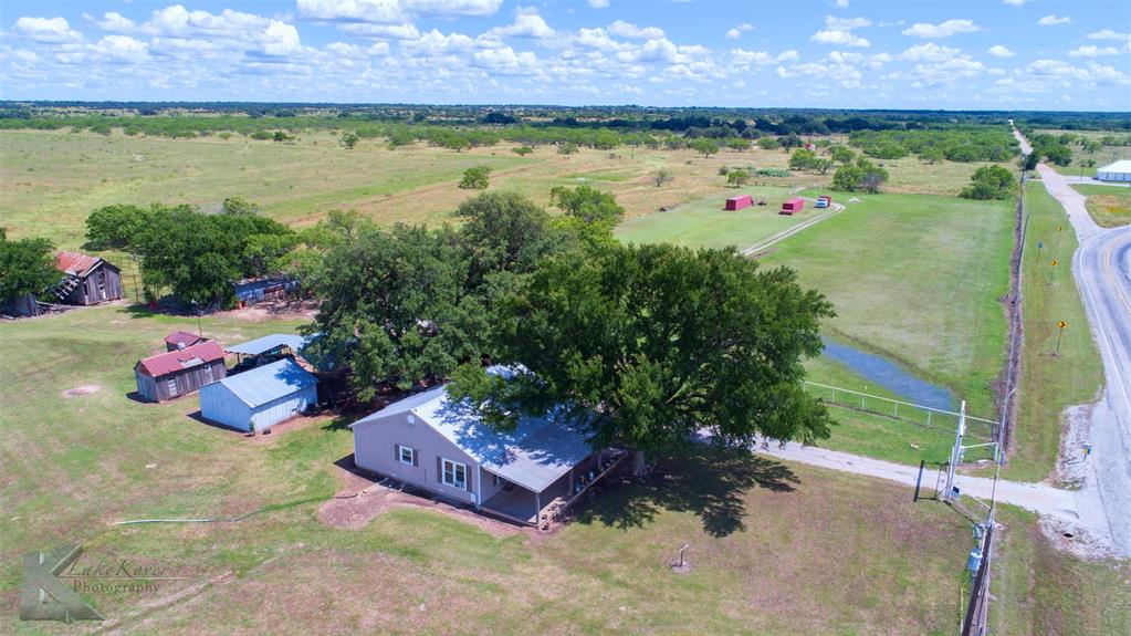 7528 Farm To Market 717 Ranger, TX 76470 - Photo 16 of 38 a view of a backyard with plants and a table