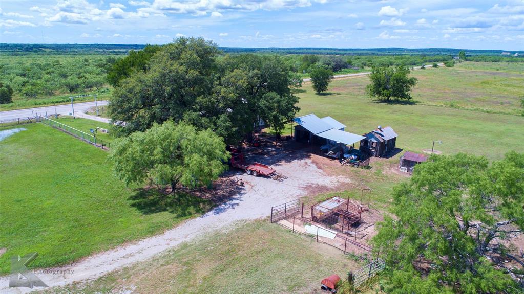 7528 Farm To Market 717 Ranger, TX 76470 - Photo 18 of 38 a view of a lake with a building in the back