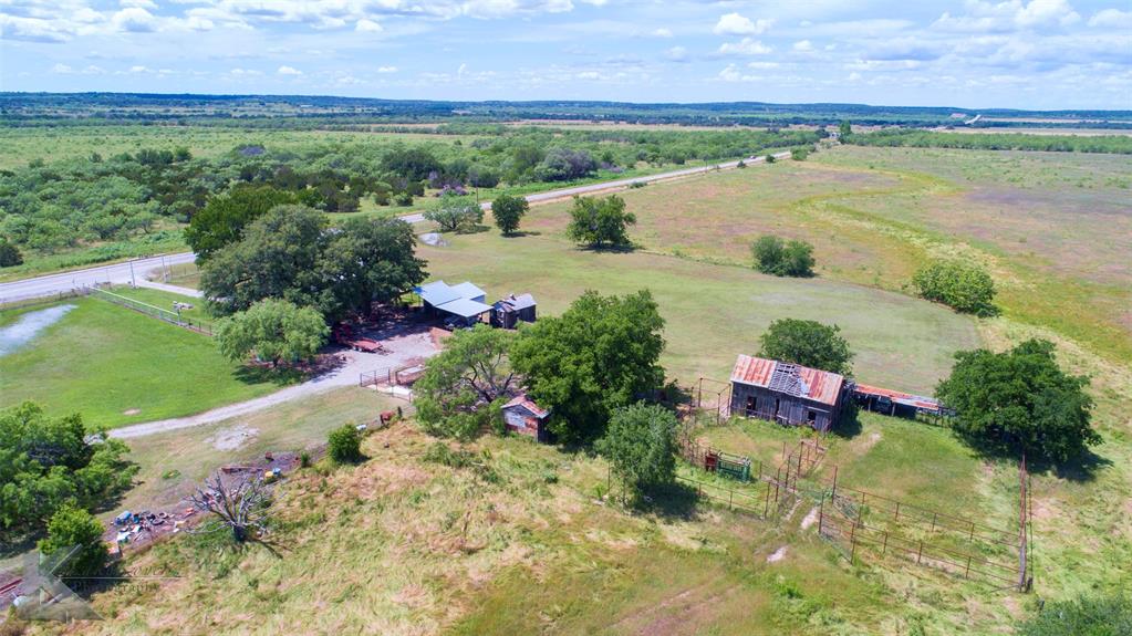 7528 Farm To Market 717 Ranger, TX 76470 - Photo 19 of 38 a view of a lake with a building in the background