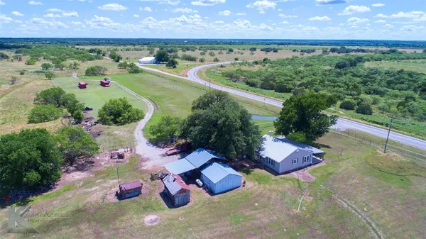 an aerial view of a houses with outdoor space