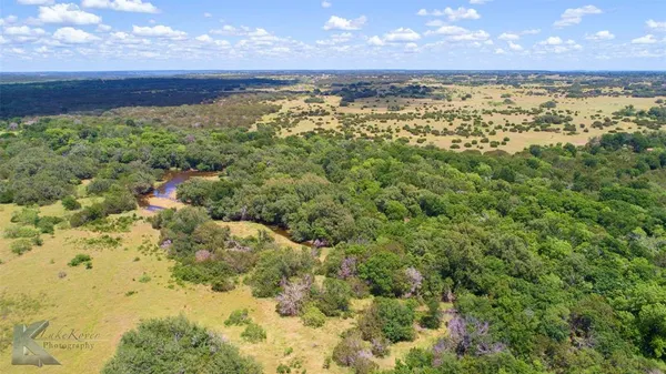 a view of a city with an ocean