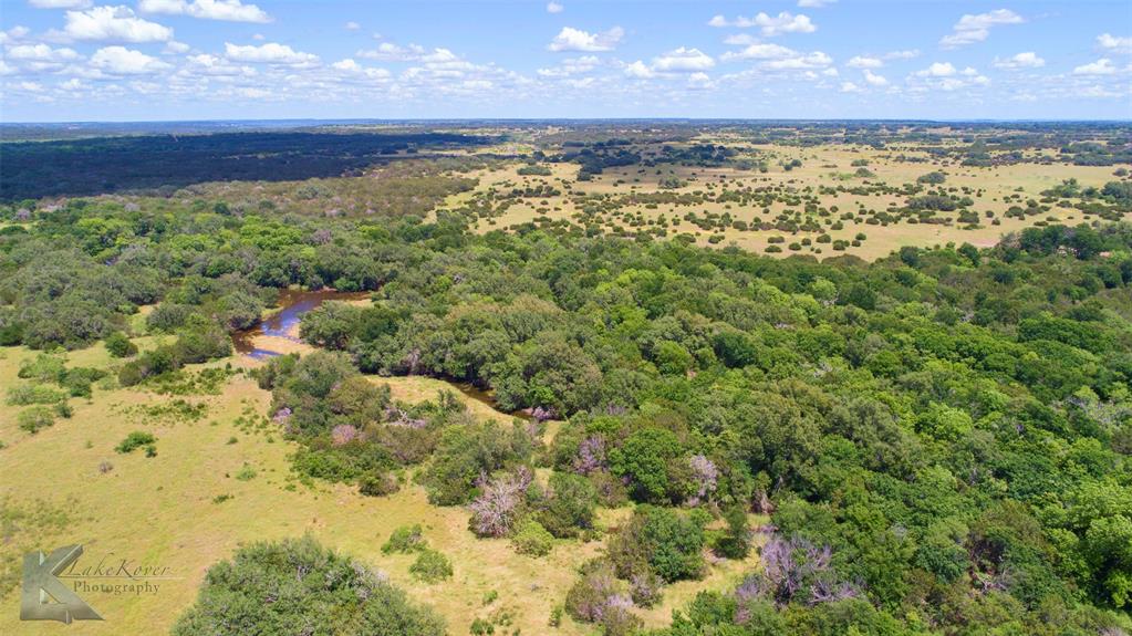 7528 Farm To Market 717 Ranger, TX 76470 - Photo 28 of 38 a view of a pathway of a yard with an ocean and mountain in the back