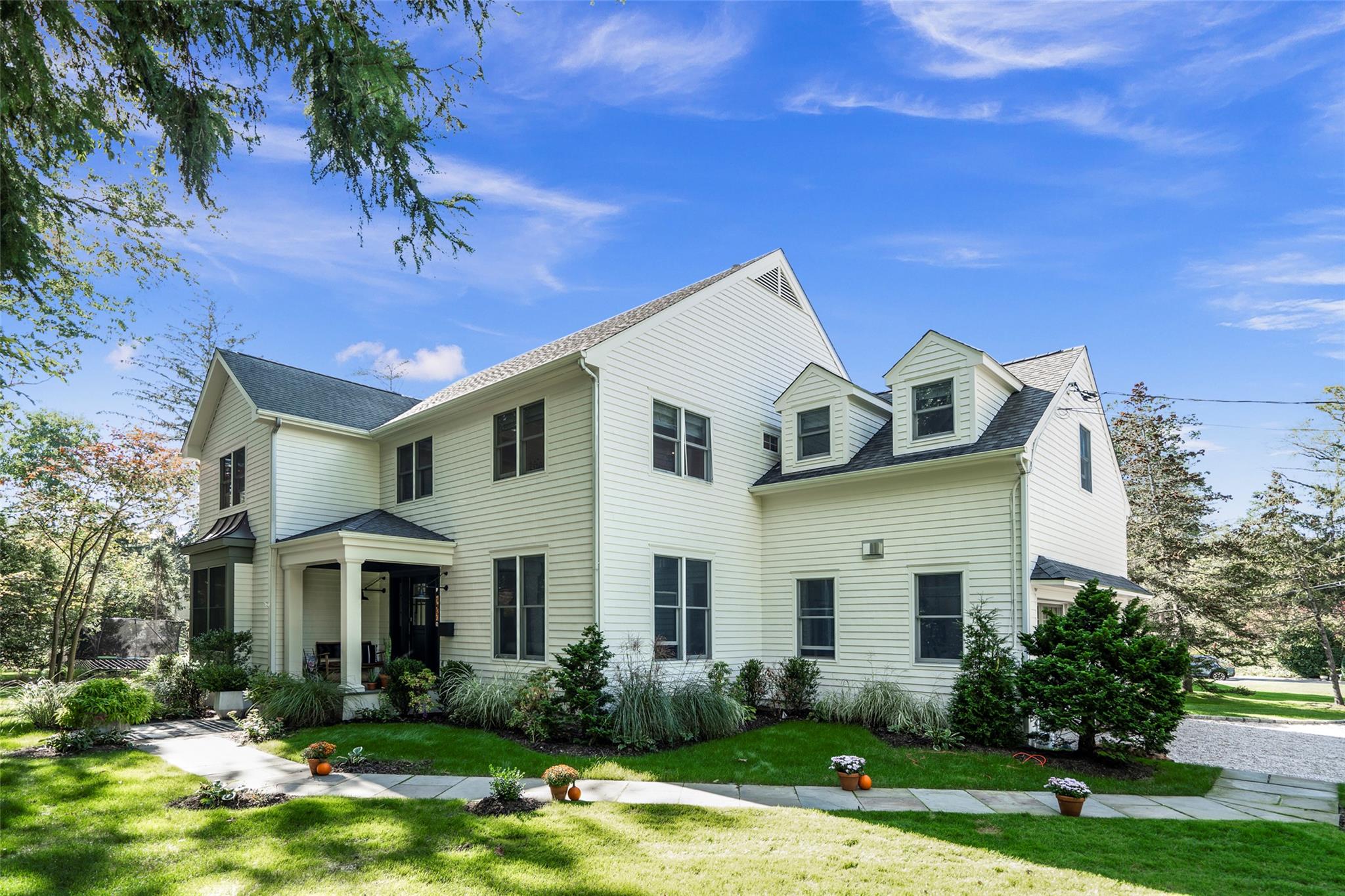 a front view of a house with garden