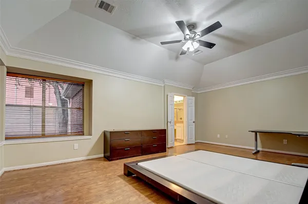a living room with furniture and a ceiling fan
